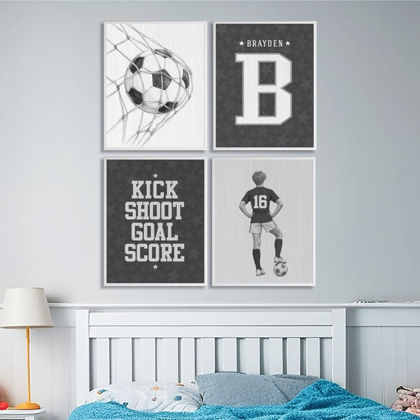Set of 4 soccer wall art prints framed above a bed in a boys sports bedroom