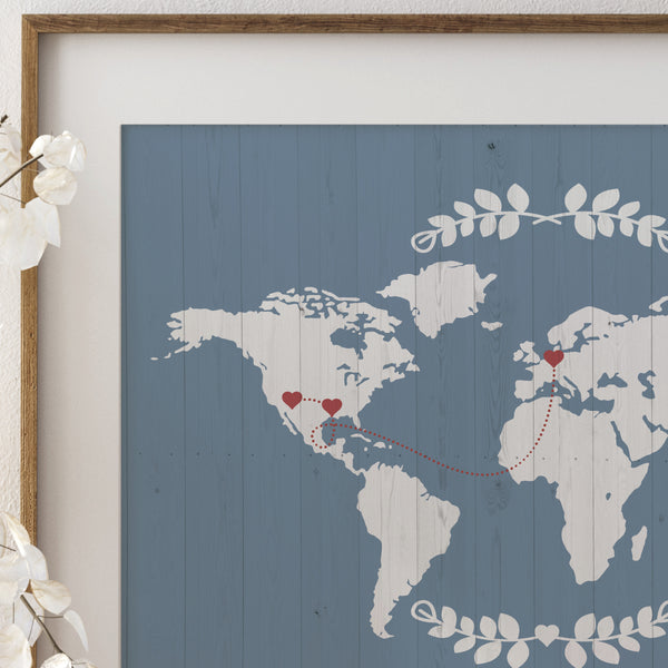 Close-up of personalized world map art showing detailed watercolor map textures and heart markers