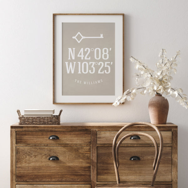 Sentimental first apartment decoration featuring custom home location coordinates